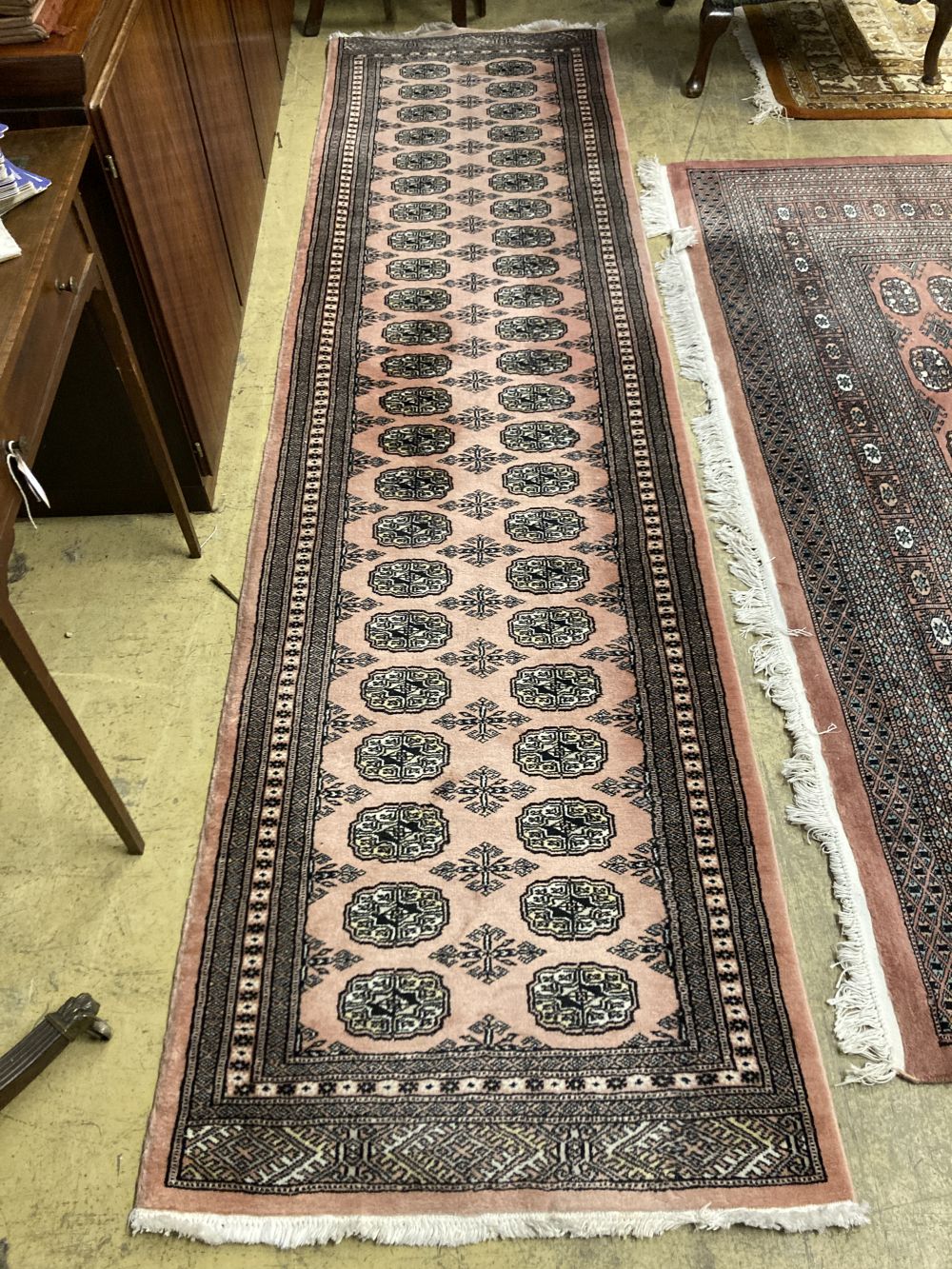 A Bokhara red ground small carpet, a pink ground runner and two other rugs (4), largest 320 x 222cm